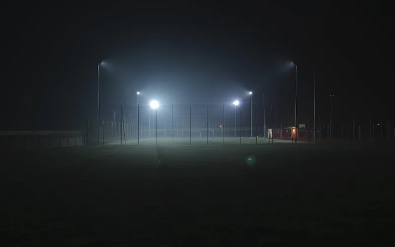 Floodlit stadium at night hosting the Australian football codes offered as sports betting markets